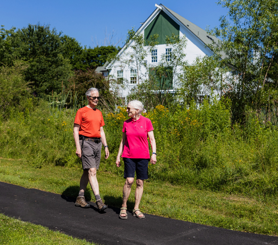 couple hiking on path